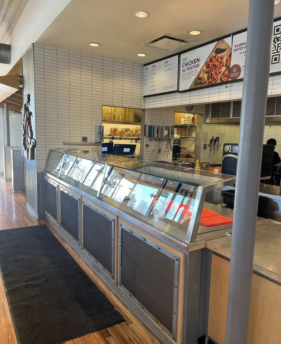 Restaurant counter clad in stainless steel panels