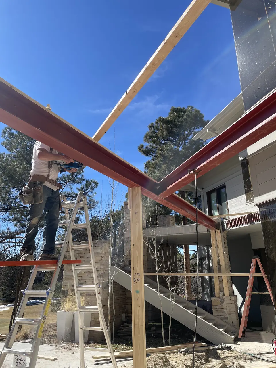 Structural steel beams being installed on a building frame